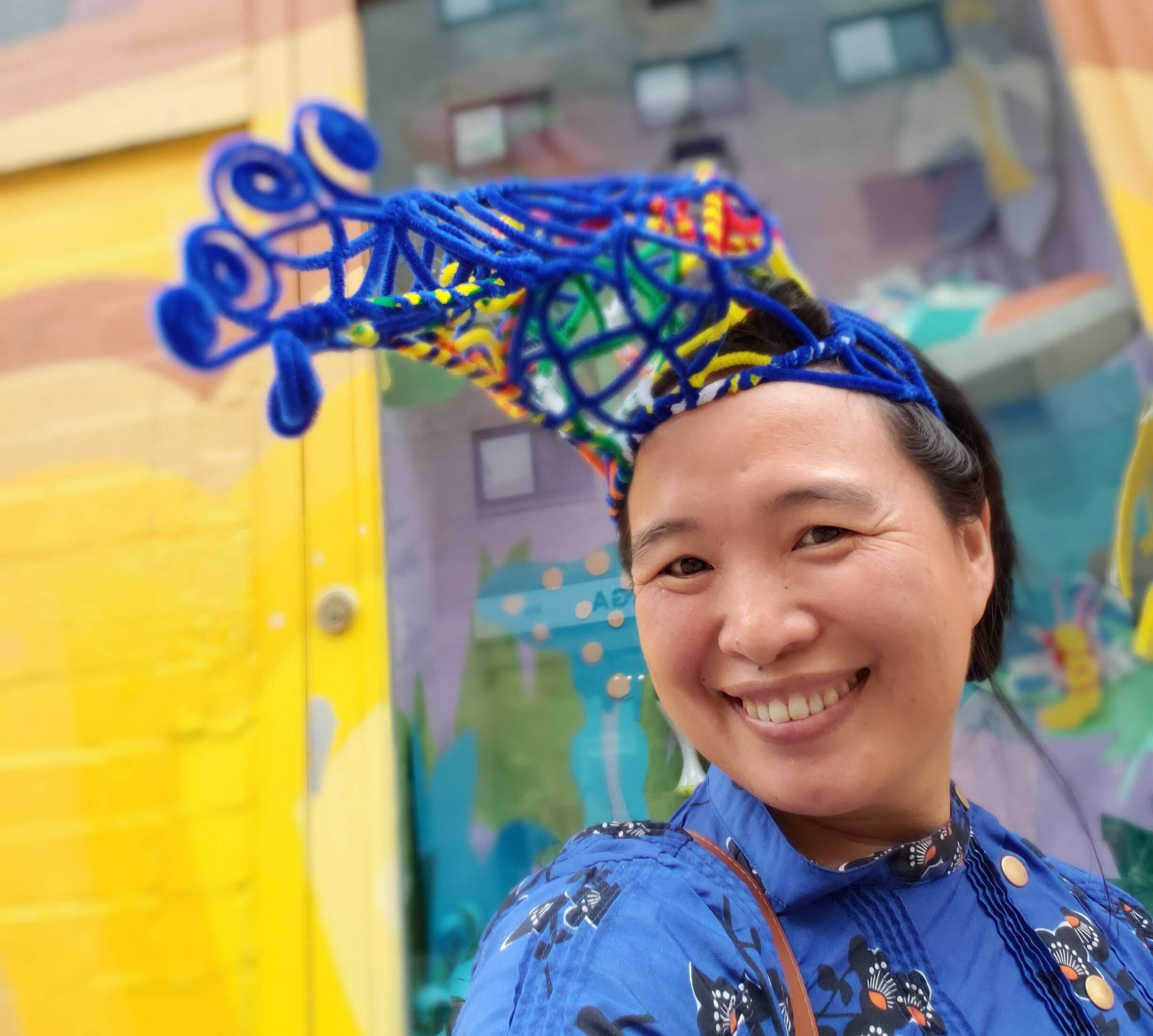 Lee Kim with a pipe cleaner fascinator